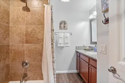 a bathroom with a shower and a sink at Inviting 2-BR Condo in the heart of Imperial Beach in Imperial Beach