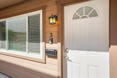 a white door of a house with a window at Inviting 2-BR Condo in the heart of Imperial Beach in Imperial Beach