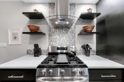 a kitchen with a stove and a counter top at Relaxing Beach Bungalow in San Diego