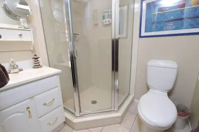 a bathroom with a shower and a toilet and a sink at Mission Bay Studio w Ocean Views from Rooftop Deck in San Diego
