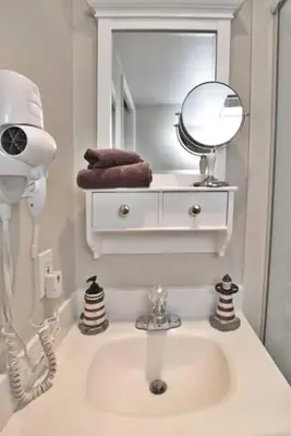 a bathroom with a sink and a mirror at Mission Bay Studio w Ocean Views from Rooftop Deck in San Diego