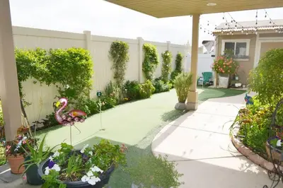 a garden with a flamingo in the middle of a yard at Mission Bay Studio w Ocean Views from Rooftop Deck in San Diego