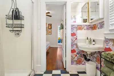 a bathroom with a sink and a mirror at Bright and Quirky Hillcrest Craftsman in San Diego
