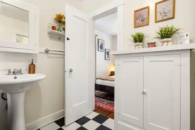 a bathroom with a sink and a mirror at Adorable Quirky Hideaway BIG Private Enclosed Yard in San Diego