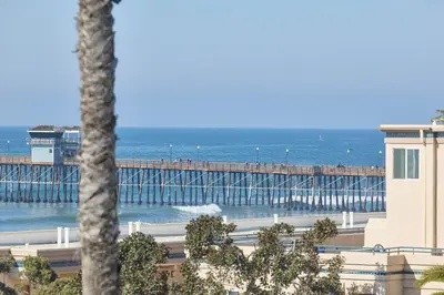 a view of a pier with the ocean at 152-4 Coastal Luxury with Panoramic Ocean View in Oceanside