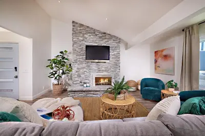 a living room with a couch and a fireplace at 152-6 S Pacific Fantastic Ocean View in Oceanside