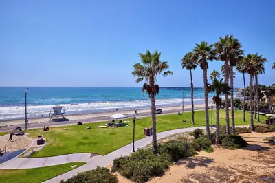 a view of a beach with palm trees and the ocean at 152-6 S Pacific Fantastic Ocean View in Oceanside