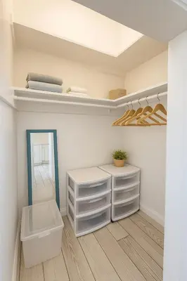 a dressing room with white drawers and a mirror at Urban Nest with private Patio in Golden Hill - walk everywhere! in San Diego