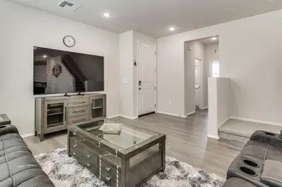 a living room with a couch and a tv at Near Hospitals Home with Pool Access in Temecula in Temecula