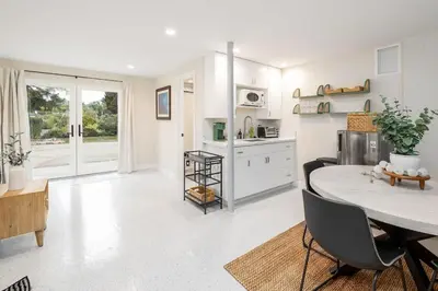 a kitchen and dining room with a table and chairs at Brand New Studio in Carlsbad in Carlsbad