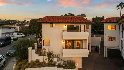 a white house with a view of a street at Steps to the Beach Modern 3BDR w Patio 257 Trailhead Trestles 1 by AvantStay in San Clemente