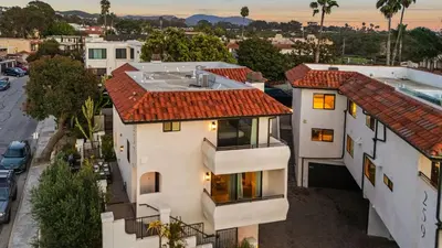 an aerial view of a white house with a red roof at Steps to the Beach Modern 3BDR w Patio 257 Trailhead Trestles 1 by AvantStay in San Clemente