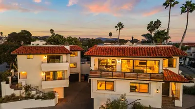 a house with a view of the sunset at Steps to the Beach Modern 3BDR w Patio 257 Trailhead Trestles 1 by AvantStay in San Clemente
