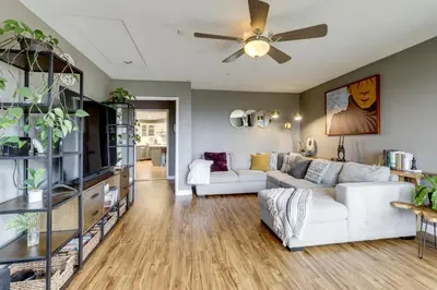 a living room with a white couch and a ceiling fan at Near Hiking Trails! Luxe Family Home in Lakeside in Lakeside