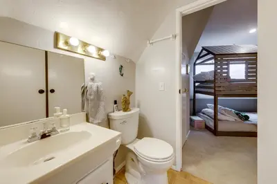 a bathroom with a toilet and a sink and a bed at Near Hiking Trails! Luxe Family Home in Lakeside in Lakeside