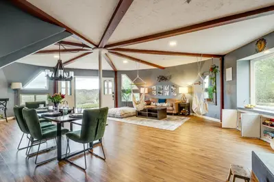 a dining room and living room with a table and chairs at Near Hiking Trails! Luxe Family Home in Lakeside in Lakeside
