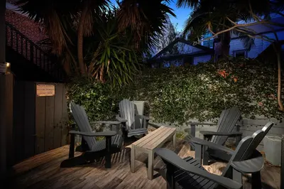 a group of chairs and tables on a deck at Stunning 4 BR 3 BA Convention Center Gaslamp Petco in San Diego