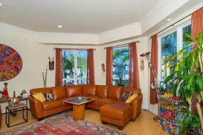 a living room with a couch and a table at Oceanview Beach Home - 209W in Oceanside