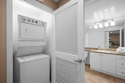 a white kitchen with a stove and a sink at Modern 2BR Cozy Apartment in Irvine in Lake Forest