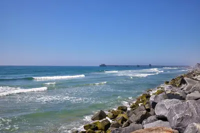 a view of the ocean from a rocky beach at 700-104 Water Front Condo w AC in Oceanside