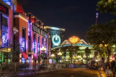 a city street at night with lit up buildings at Entire Private Studio with King Bed, Bathroom, 1 Parking, Available Now in Spring Valley