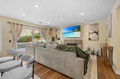 a living room with a large couch and chairs at Entire Private Home with 4 Bedrooms, Pool, Hot Tub, King Bed, Garage, Available Now in El Cajon