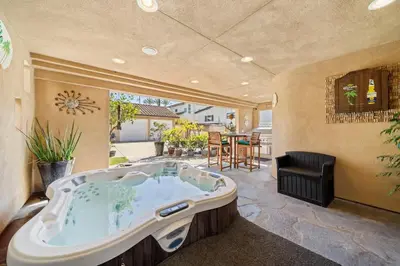 a jacuzzi tub in a room with a patio at Hot Tub Ocean Views 3 Bedroom Private Home in Carlsbad