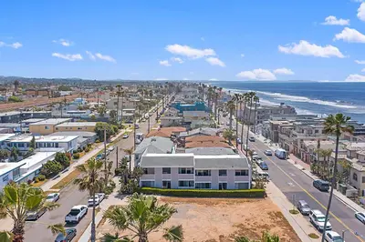 an aerial view of a city with the ocean at Sunrise & Sunset by the Sea 812-1 in Oceanside