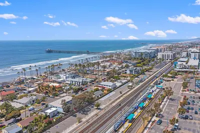 an aerial view of a city and the ocean at Sunrise & Sunset by the Sea 812-1 in Oceanside