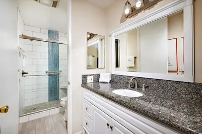 a bathroom with a sink and a shower at North Coast Village D204 in Oceanside