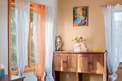 a room with a wooden cabinet and a window at Beso De Cielo or Slow Sip of Solitude in Alpine