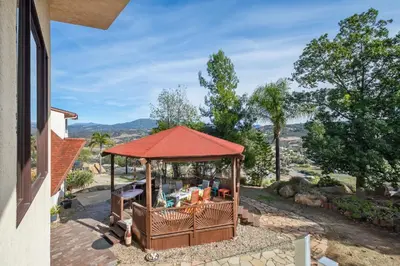 a gazebo with a red roof on a house at Beso De Cielo or Slow Sip of Solitude in Alpine