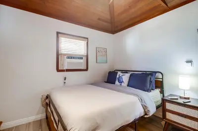 a small bedroom with a bed and a window at Coastal SD Retreat Studio Pets Close to Ocean in San Diego