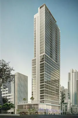 a tall white skyscraper in a large city at Le Méridien San Diego Downtown in San Diego