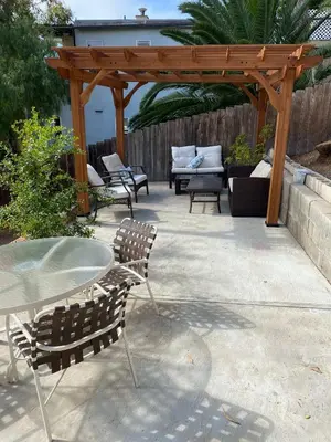 a patio with a table and chairs and a wooden pergola at Cozy Apt W Patio Bankers Hill SD in San Diego