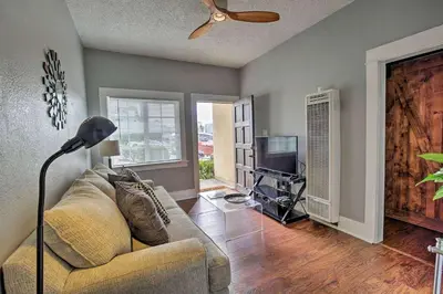 a living room with a couch and a television at Cozy Apt Near GasLamp in San Diego