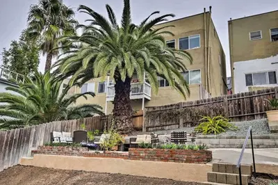 a palm tree in front of a building at Cozy Apt Near GasLamp in San Diego