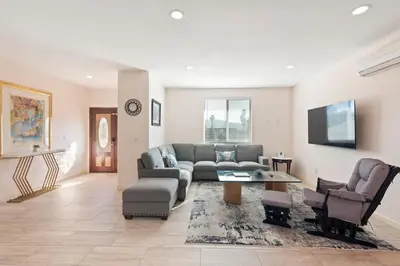 a living room with a couch and a table and chairs at Spacious Single Level Home In Poway in Poway