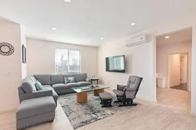a living room with a couch and a table and chairs at Spacious Single Level Home In Poway in Poway
