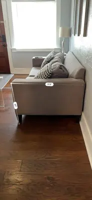 a bed in a room next to a window at Little Italy Apt in San Diego