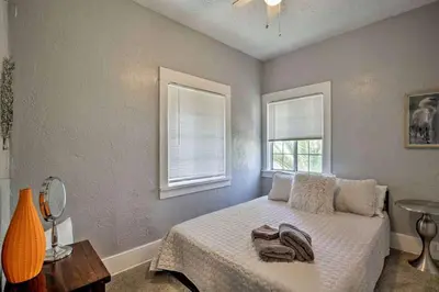 a bedroom with a bed and two windows at Apt in San Diego in San Diego