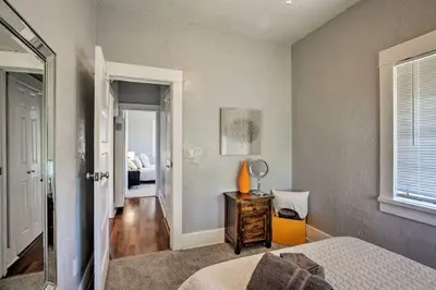 a bedroom with a bed and a mirror at Apt in San Diego in San Diego
