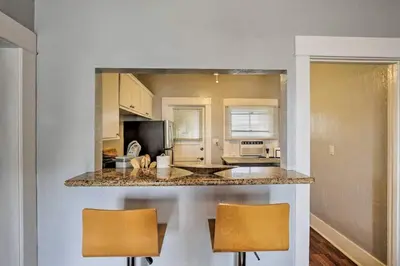 a kitchen with two chairs and a counter top at Apt in San Diego in San Diego