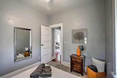 a room with a mirror and a bed with a table at Apt in San Diego in San Diego