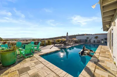 a swimming pool with a shark in the water at Bayside Bliss House - Pool Spa Views in San Diego