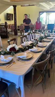 a group of people standing around a long table at The Chateau Escondido in Escondido