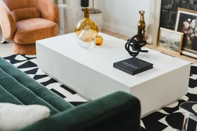 a white coffee table in a living room with a green couch at Luxe Victorian Retreat • Walk to Downtown in San Diego