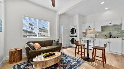 a living room with a couch and a table at Central Spot - 4 Min to Waterpark, Dining & Shops in Vista