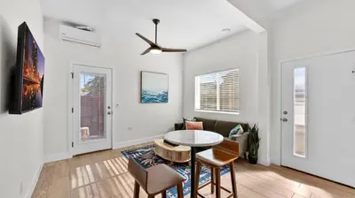 a living room with a table and chairs at Central Spot - 4 Min to Waterpark, Dining & Shops in Vista