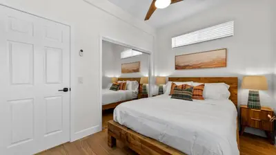 a bedroom with two beds and a white door at Central Spot - 4 Min to Waterpark, Dining & Shops in Vista